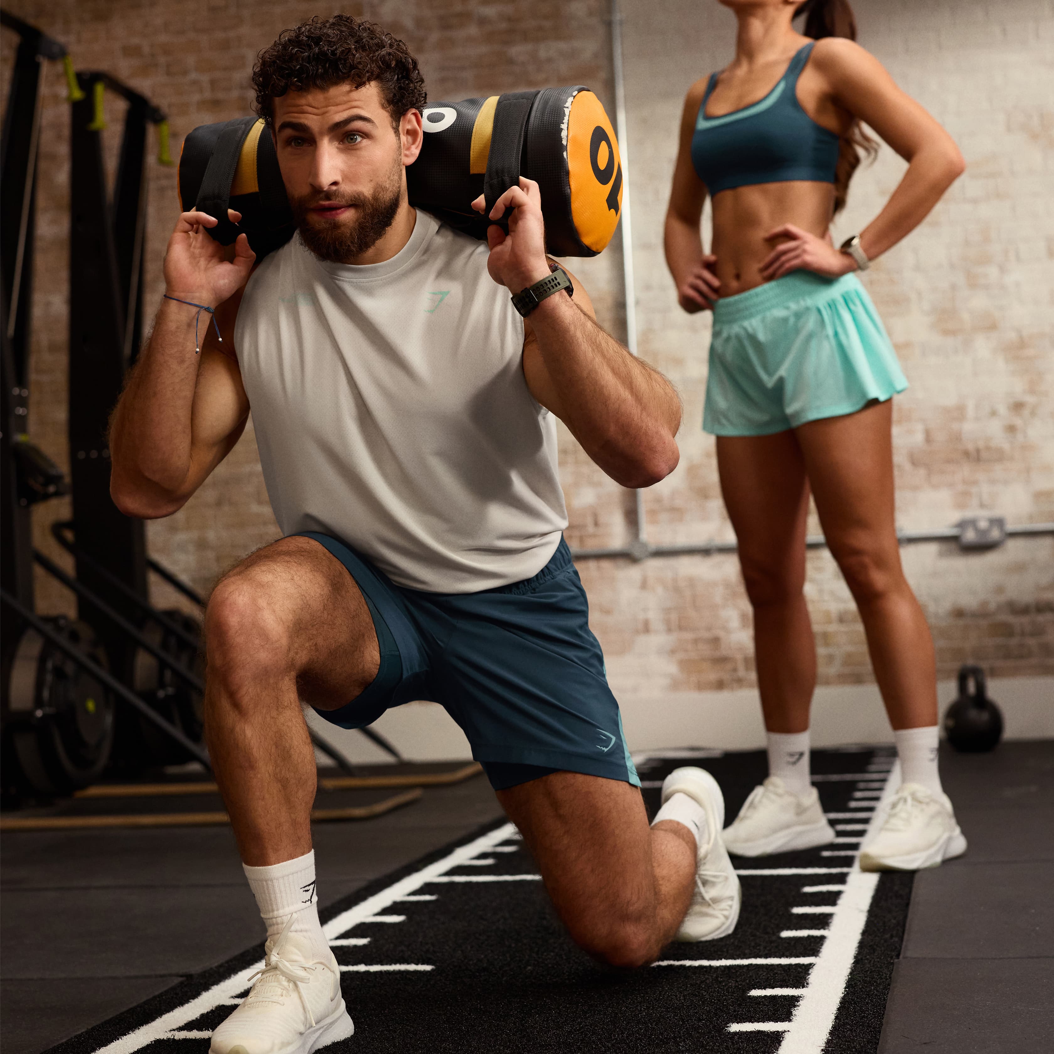 Perfect Your Sandbag Lunges With These Progressions & Technique Tips